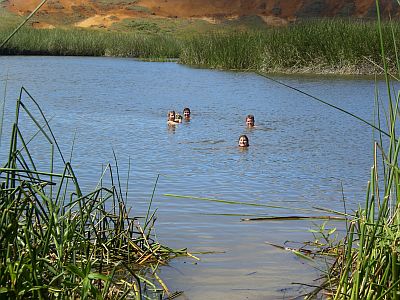 Group Drunvalo swims in sweet water lake in volcano
